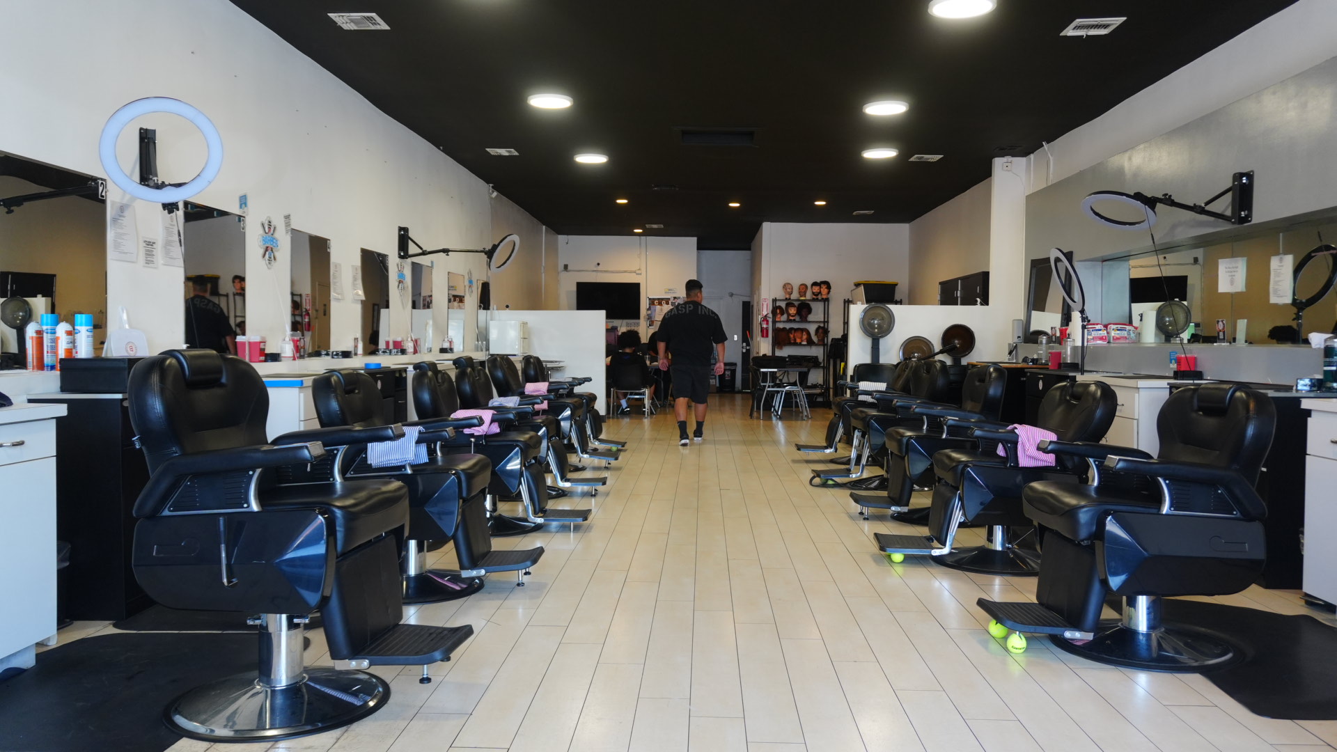 The barber college floor lined with chairs and stations